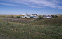 Milford Hutterite farm colony near Raymond in Southern Alberta.  Hutterites are a communal branch of Anabaptists forming male dominated rural colonies.