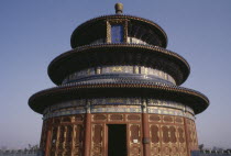 Exterior of the Hall of Prayer for Good Harvests in the Temple of Heaven complex.  Triple gabled circular building built on three levels. Peking