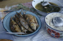 Typical meal of  fish served with rice and a piquant sauce.