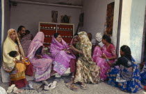 Women buying silver jewellery.