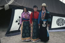 Tibetan mother and daughters dressed in their traditional best clothes.