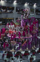 Carnival float carrying dancers dressed in glittering costumesBrasil