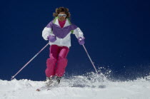 Lone woman skis towards camera  Ski Skiing Ski Skiing