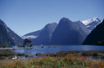 View across the fjord to snow capped mountains