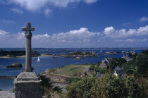 Coastal view from the Churchyard with stone cross in the foreground