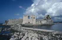 Ruins of stone fort and crenellated walls.