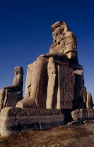 The Colossi of Memnon. The only remains of the Mortuary Temple of Amenophis III