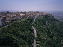 A road leading to the city   view West over the rooftops from Castello di Lombardia. The highest provincial capitol in Italy  931 m