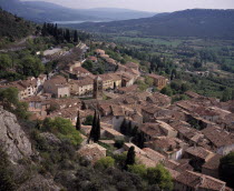 View South over the roof tops of the village Moustiers Saint Marie with the Saint Croix lake in the background