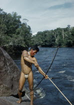 Man fishing with  macana  wood bow and bamboo arrow in rio PiraparanaIndigenous Tribes  rio Piraparana North West Amazonia Amazon American Colombian South America Vuapes Columbia Hispanic Indegent La...