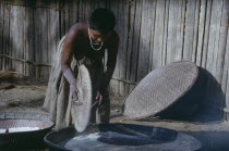 Girl prepares clay oven for baking  casabe  yucca flour into Tukano daily bread     Indigenous Tribes  rio Piraparana North West Amazonia Amazon American Colombian South America Vuapes Columbia Hispa...
