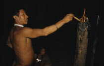 Headman lights a  breo  resinous torch in centre of the  maloca  / longhouse.Indigenous Tribes  rio Piraparana North West Amazonia Amazon American Center Colombian Kids South America Vuapes Columbia...