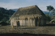Old thatched dwelling in foreground with shelter for drying maize behind in Yuko-Motilon village. Indigenous Tribes Colombian / Venezuelan Border Area American Colombian South America Columbia Hispan...