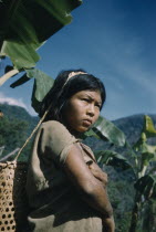 Young girl with woven cane basket for carrying maizeIndigenous Tribes Colombian / Venezuelan Border Area American Colombian Kids South America Columbia Hispanic Indegent Latin America Latino