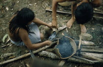 Woman pouring  breo  / melted beeswax into a fired  cantaro  / clay water pot which will now be watertightThe Noanama are a minority group of approximately 3000 Indians. The Noanama live in an area o...