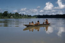 Mother paddles her family across the lower rio San JuanThe Noanama are a minority group of approximately 3000 Indians. The Noanama live in an area on the Pacific coast of Colombia which is known as t...