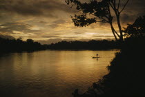 Boy paddling canoe on lower rio San Juan at sunsetThe Noanama are a minority group of approximately 3000 Indians. The Noanama live in an area on the Pacific coast of Colombia which is known as the Ch...