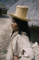 Portrait of young Kogi vasayo / commoner with straw hat  woven cotton  manta  / cloak and woven  fique   cactus fibre  shoulder bagsIndigenous TribesCaribbean coast of Colombia. American Colombian F...