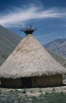 Kasiquial  a ritual meeting centre for Kogi  mamas   / priests. Sacred potsherds in rack at apex of conical thatched roof indicate this is a nuhue / temple.Indigenous TribesCaribbean coast of Colomb...