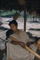 Headman playing beeswax axe-head flute  the body made from very light  yarumo   a type of balsa  wood. Wearing finely woven cotton  manta   / cloakIndigenous Tribes American Colombian South America C...