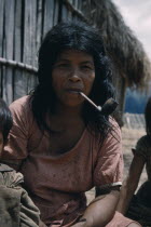 Mother smoking tobacco in a clay pipeIndigenous Tribes American Colombian Mum South America Columbia Hispanic Indegent Latin America Latino