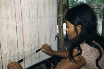 Girl weaving cotton  manta   / cloak at a Yuko - Motilon household loom in village near  the Colombian-Venezuelan frontier  Indigenous TribesAmerican Kids South America Columbia Hispanic Indegent La...