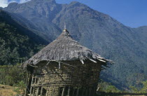 South side of Sierra Nevada de Santa Marta. Deserted nuhue/temple below religious centre of Surlivaka. The old destroyed roof apex no longer contains sacred potsherds. American Colombian European Re...