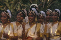 Mohiniyattam dancers at The Great Elephant March festival. A group of young girls with hair decoration  gold jewellery  earrings and nose rings. Kerela
