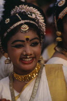 Mohiniyattam dancer at The Great Elephant March festival. Hair decoration  earrings and nose rings. Kerela