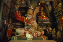 Interior of the Zong Dog Palri Fobrang Monastery. Statues of various figures  some seated  some standing.