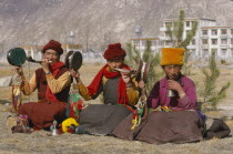 Monk musicians  two of which are playing horns made from human thigh bones  near the Potala Palace.