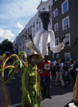 Notting Hill carnival reveller in extravagant costume.Parade  Nottinghill