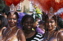 Notting Hill carnival three women revellers.Nottinghill