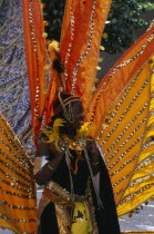 Notting Hill carnival woman in extravagant costume.Nottinghill