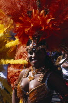 Notting Hill carnival female reveller in extravagant costumeNottinghill