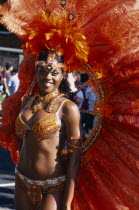 Notting Hill carnival female reveller in extravagant costumeNottinghill