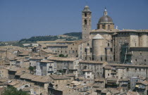 Palazzo Ducale rising above city rooftops.  Built for Duke Federico da  Montefeltro the ruler of Urbino between 1444 and 1482.