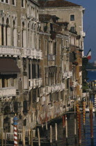 The Grand Canal.  Waterside buildings and gondola moorings from the Rialto.