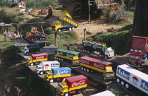 Road to Antsirabe. Colourful toy vehicles made from locally grown balsa wood painted with famous brand names