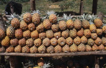Road to Antsirabe. Pineapples for sale on roadside stall