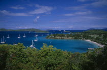 Elevated view over beach and coastline with tree covered Islands and bays on the Atlantic with yachts on the water