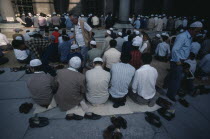 Muslim men and boys at prayer at the Sultan Ahmet Cami or Blue Mosque. Moslem