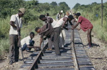 Men working on railway tracks. Zaire