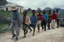 Children pretending to be soldiers marching in line. EPLF