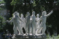 Soviet era fountain of children leaning out from a circle  holding hands.