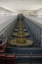 Nine large turbines inside the hydroelectric power station.hydropower