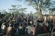 Dodoth  Karamojong warriors and elders at meeting to discuss potential attack by enemy tribe   The elders can assert power and influence over younger men.