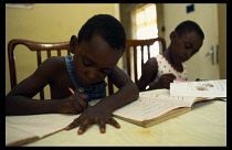 Two young children doing homework.
