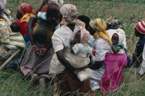 Women farmers attending a meeting of Takai da kraal agricultural co-operative  some with babies.   co-opcooperative