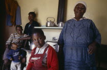 Portrait of family in domestic interior.township